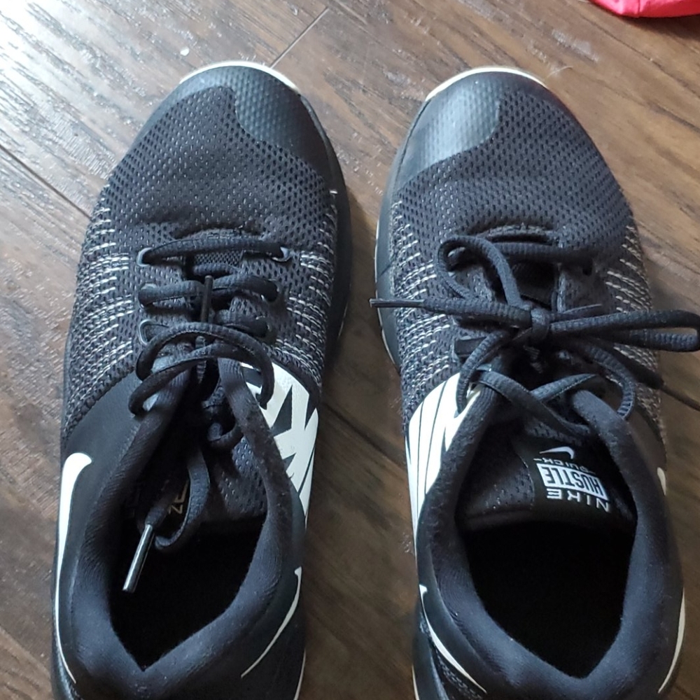 Black Nike basketball shoes.